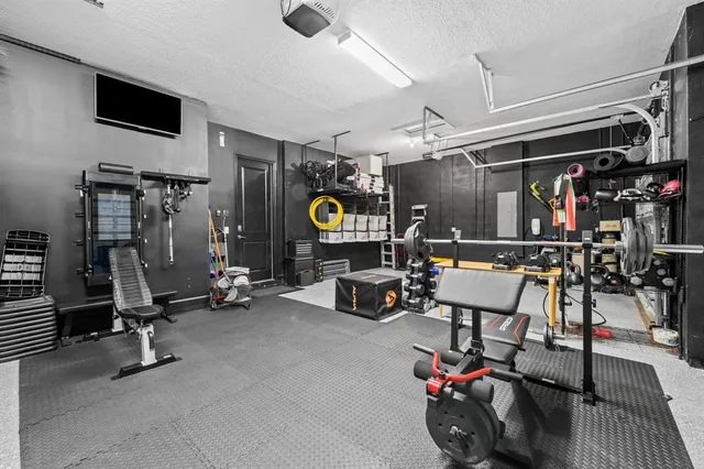 an aerial view of residential houses with outdoor space and swimming pool