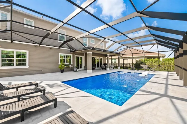 an aerial view of residential building and lake