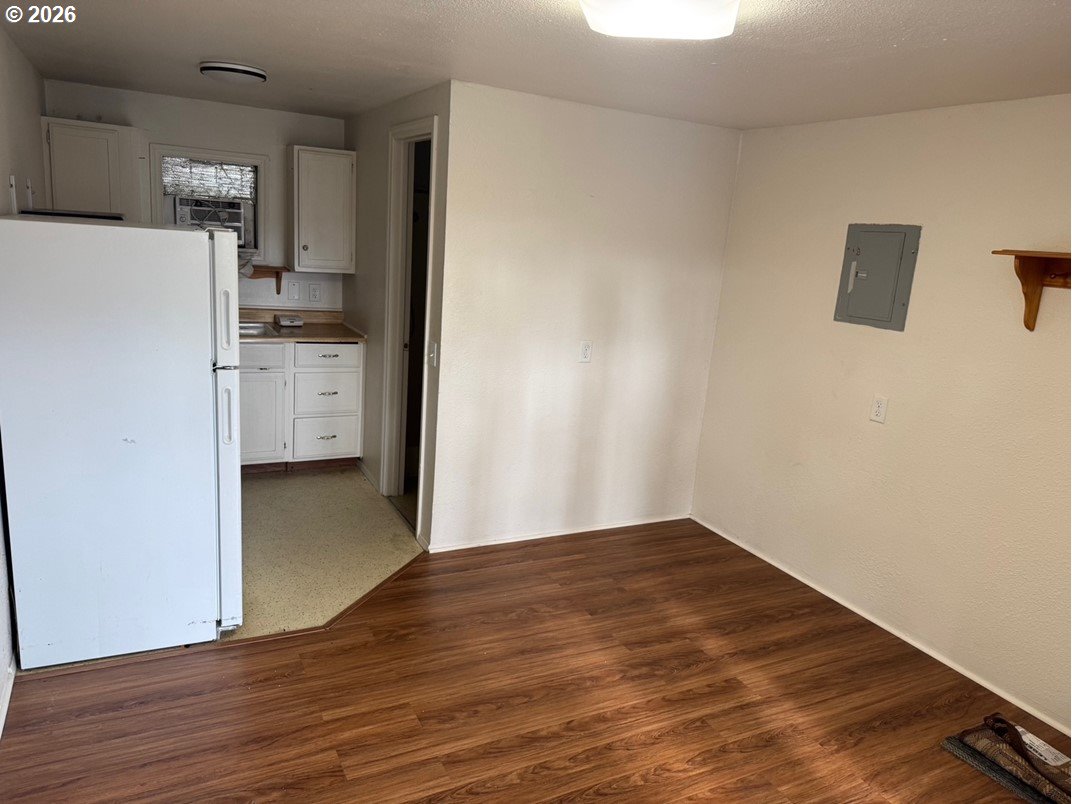 1612 Polk Street Eugene, OR 97402 - Photo 4 of 11 a view of kitchen with wooden floor and electronic appliances