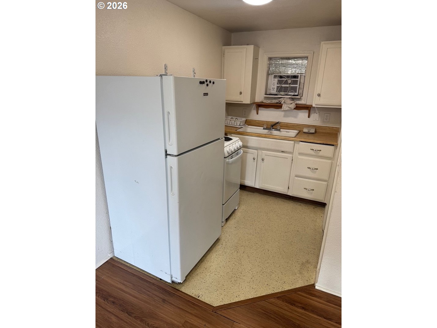 1612 Polk Street Eugene, OR 97402 - Photo 6 of 11 a kitchen with a refrigerator and a stove