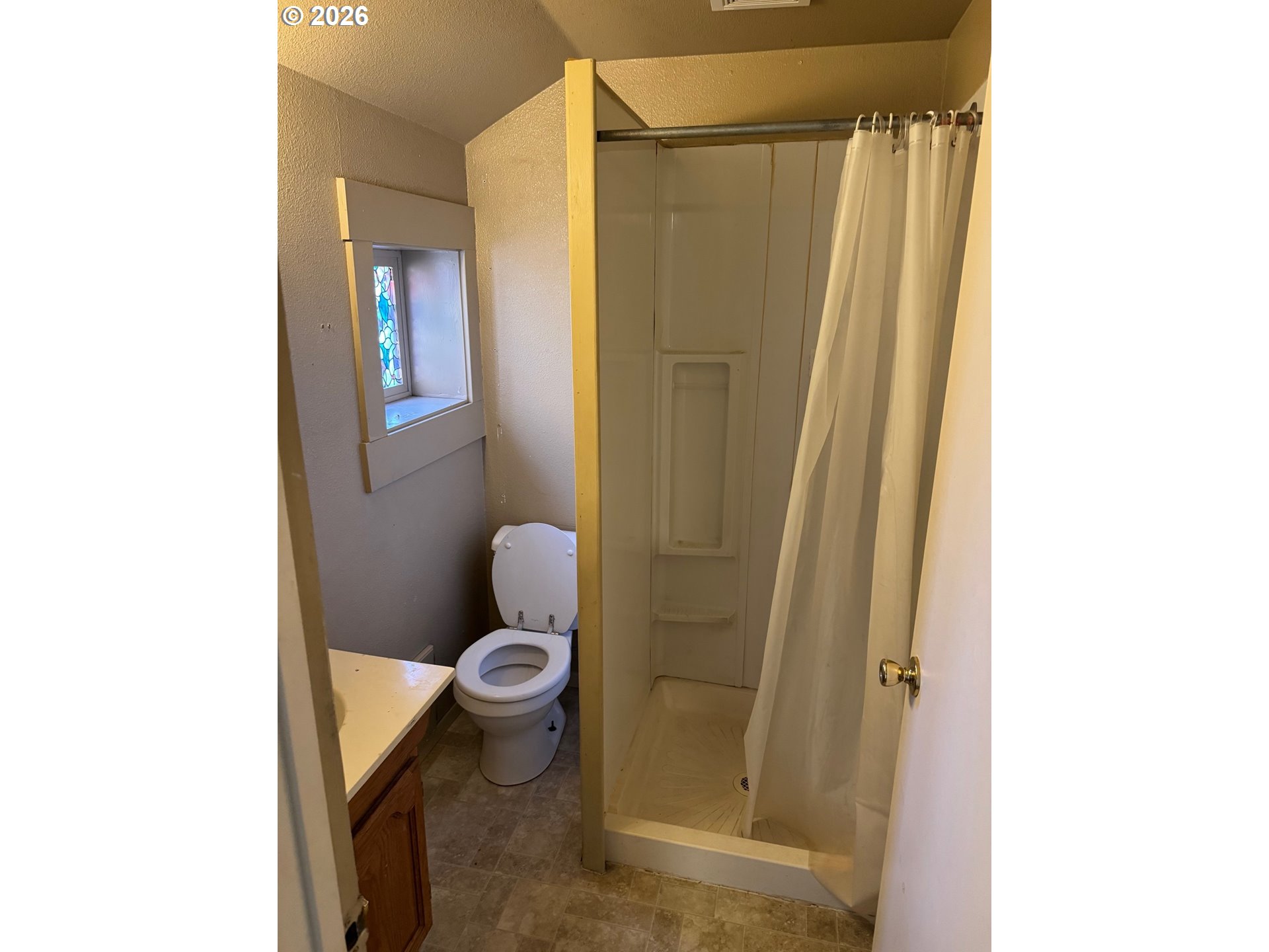 1612 Polk Street Eugene, OR 97402 - Photo 7 of 11 a bathroom with a toilet and a shower