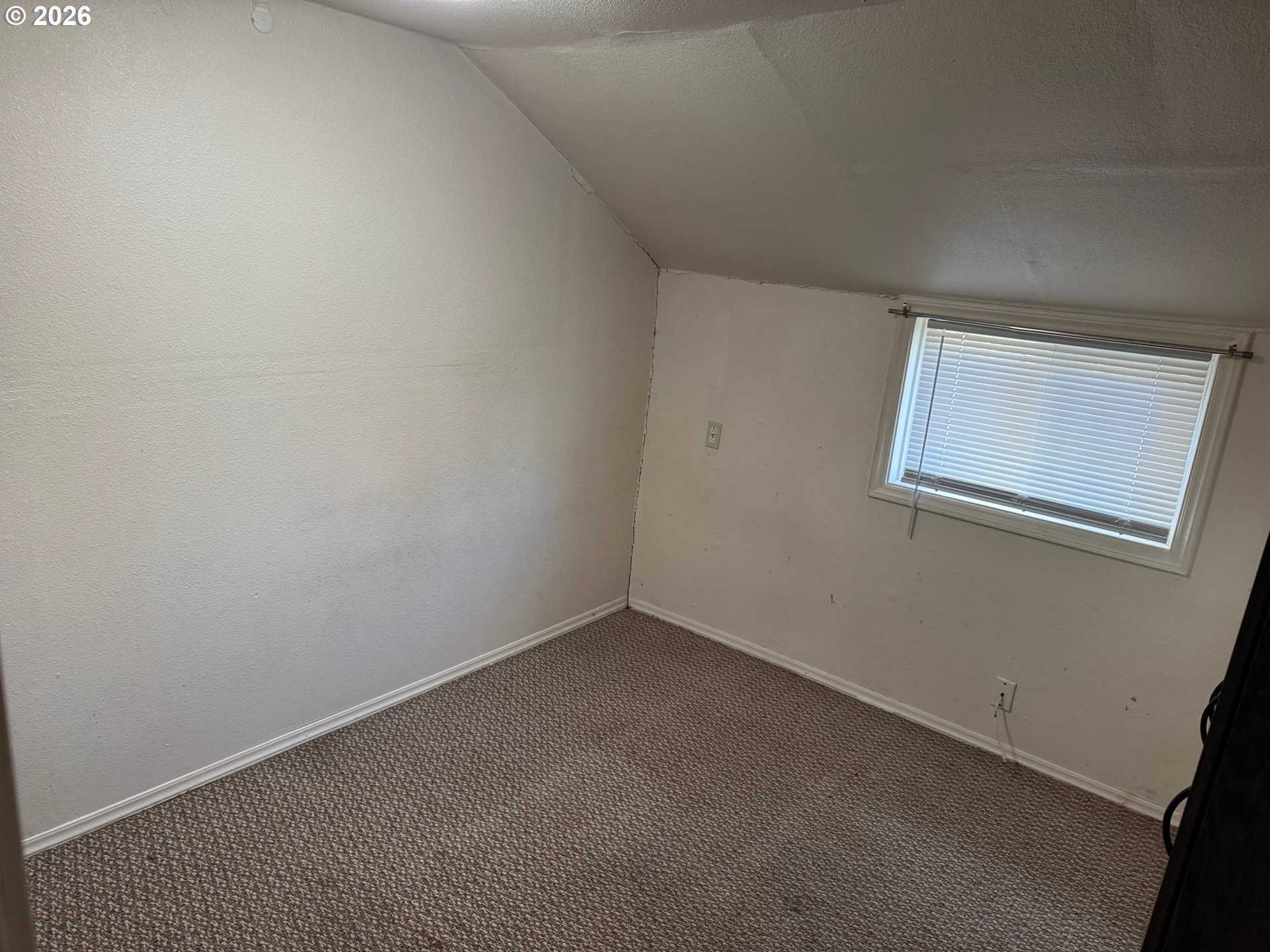 1612 Polk Street Eugene, OR 97402 - Photo 8 of 11 an empty room with a window