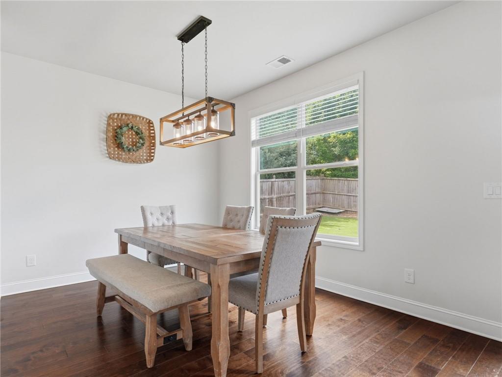 147 Fieldbrook Crossing Canton, GA 30115 - Photo 14 of 46 a view of a dining room with furniture window and wooden floor