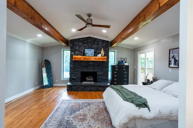 a bed room with a bed and a fireplace