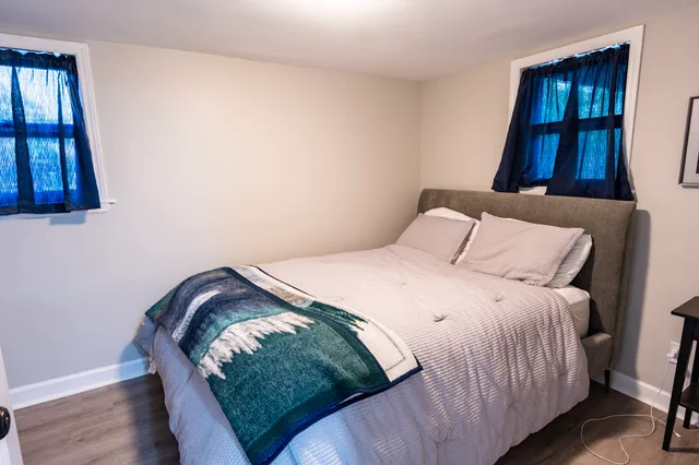 a bedroom with a bed and cabinets