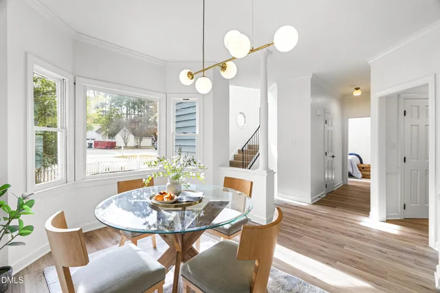 a view of a dining room with furniture window and wooden floor