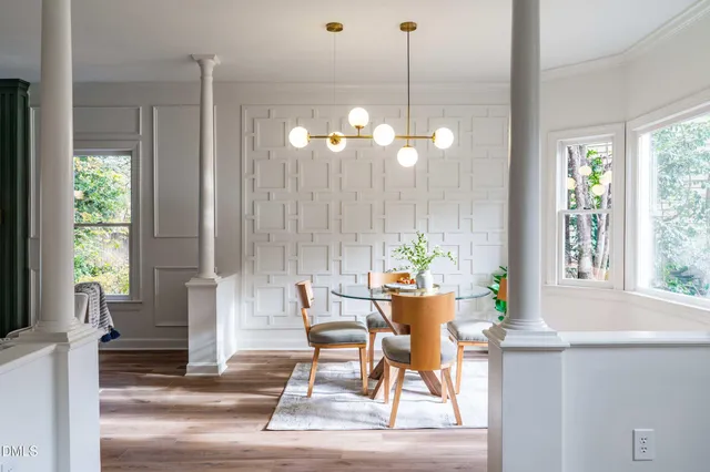 a dining room with furniture and window