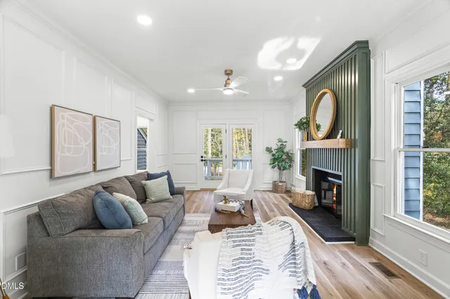 a living room with furniture and a fireplace