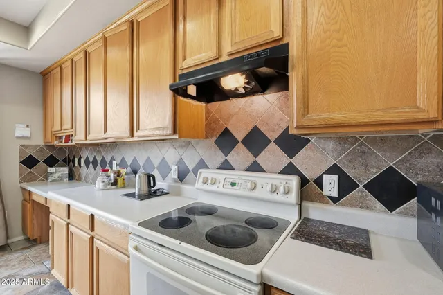 a kitchen with a cabinets and window