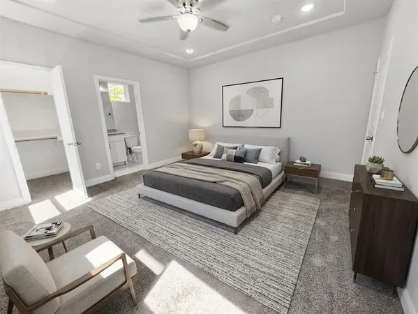 an empty room with windows and ceiling fan