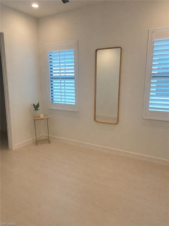 14866 Loggerhead Drive Naples, FL 34120 - Photo 10 of 16 an empty room with windows and closet