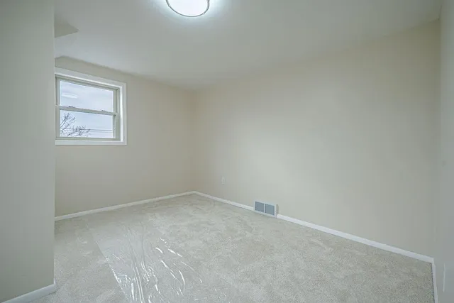 an empty room with a workbench