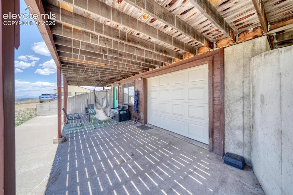 489 Excelsior Road Westcliffe, CO 81252 - Photo 28 of 34 a view of a porch with wooden floor