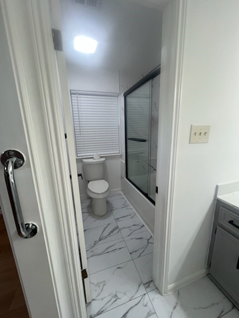 89 Coral Gables Trinity, TX 75862 - Photo 10 of 27 a bathroom with a granite countertop sink and toilet