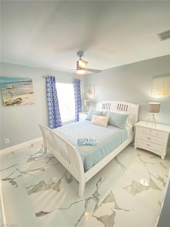 1221 Granada Boulevard Naples, FL 34103 - Photo 13 of 16 a bedroom with a bed and window