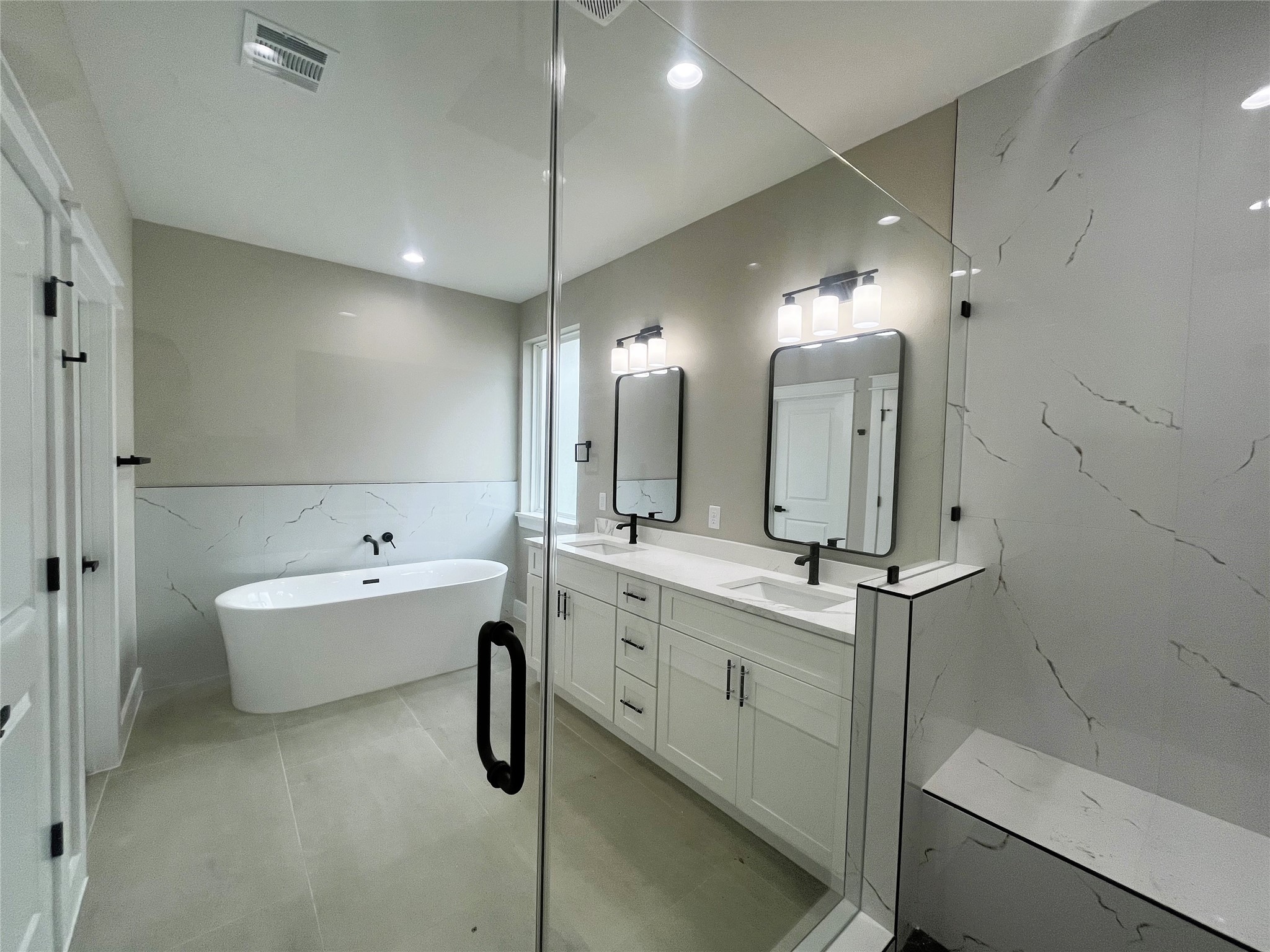 8914 Ivy Spring Lane Houston, TX 77088 - Photo 21 of 33 a bathroom with a tub sink and mirror