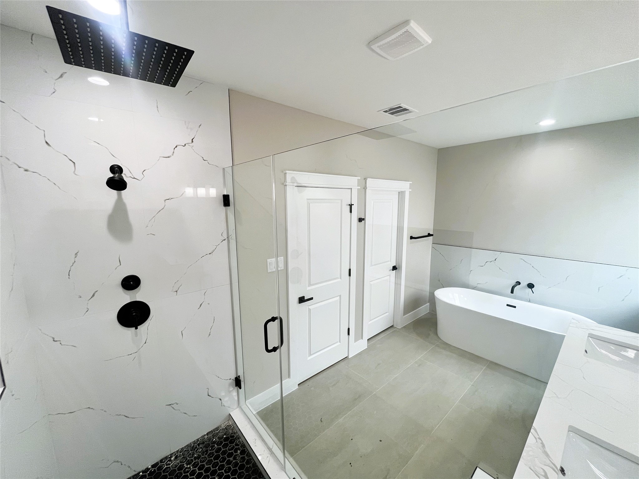 8914 Ivy Spring Lane Houston, TX 77088 - Photo 22 of 33 a spacious bathroom with a tub sink and shower