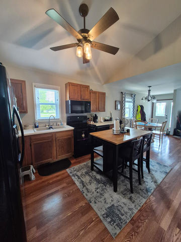 406 South Jackson Street Gardner, IL 60424 - Photo 8 of 13 a view of a dining room with furniture window and wooden floor
