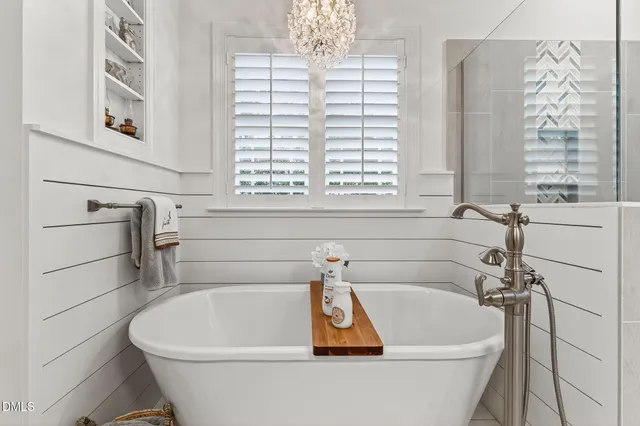 a bathroom with a shower and a mirror
