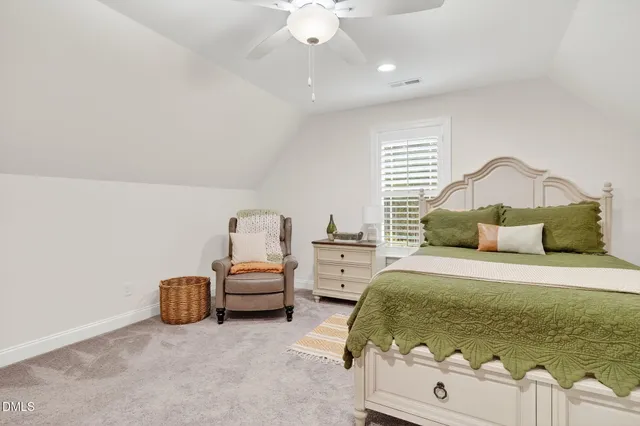 a living room with furniture pool table and a window
