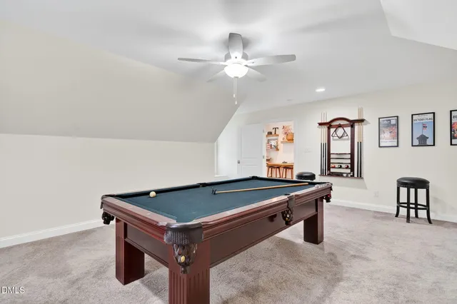 a bathroom with a sink a toilet and shower curtain