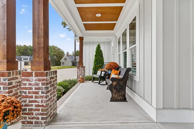 a view of a chair and tables in the balcony
