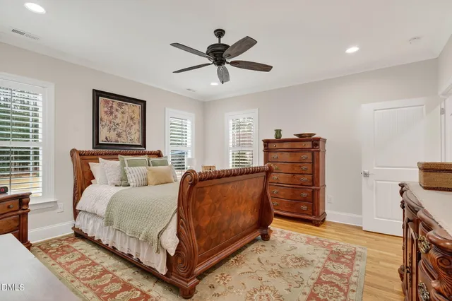 a bathroom with a granite countertop sink mirror and a bathtub