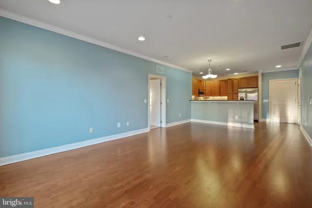 a view of a kitchen with a sink and a large window