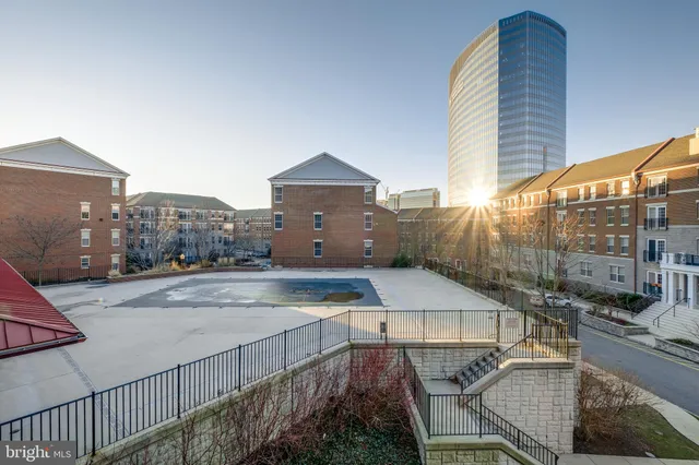 a view of a balcony with a floor to ceiling window and wooden floor