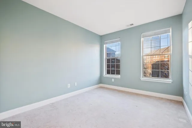 a bathroom with a tub a sink and mirror