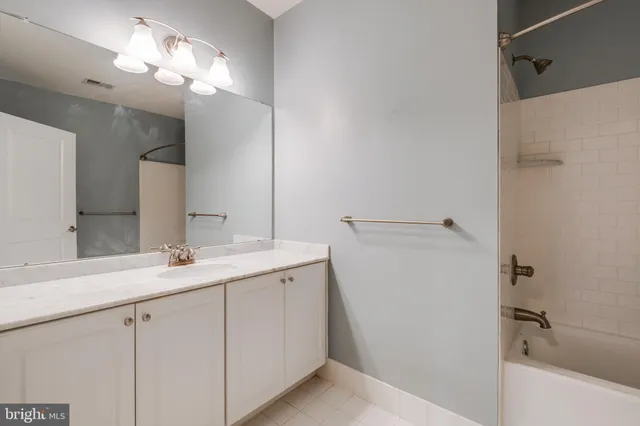 a view of a hallway with white walls