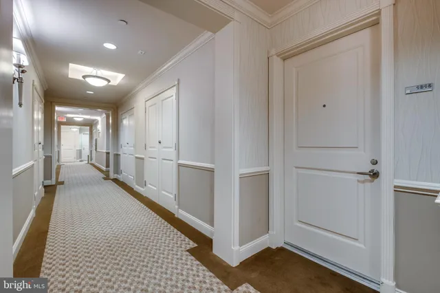 a view of kitchen with stainless steel appliances kitchen island granite countertop a refrigerator and a sink
