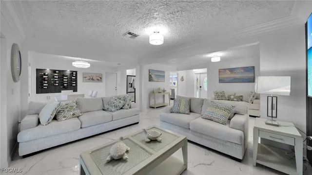 a living room with furniture and a lamp