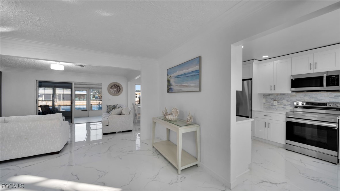 2758 Bruce Street Matlacha, FL 33993 - Photo 14 of 35 a living room with furniture and a fireplace