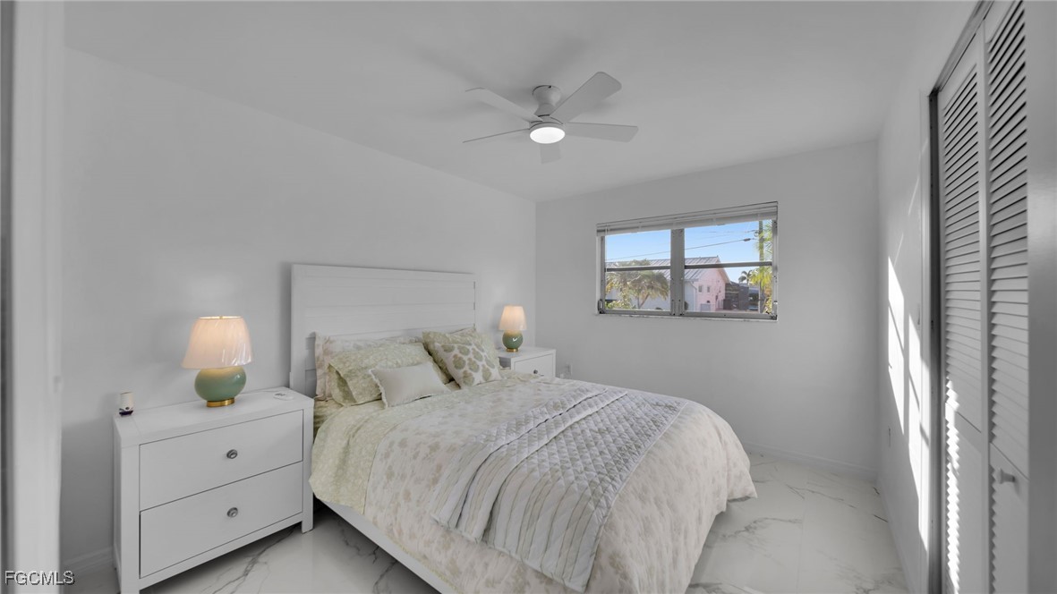 2758 Bruce Street Matlacha, FL 33993 - Photo 18 of 35 a bedroom with a bed and a window