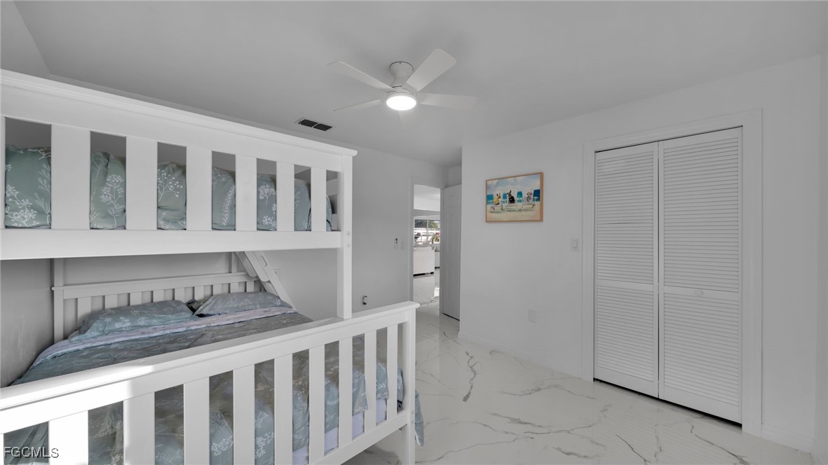 2758 Bruce Street Matlacha, FL 33993 - Photo 19 of 35 a bedroom with furniture and wooden floor
