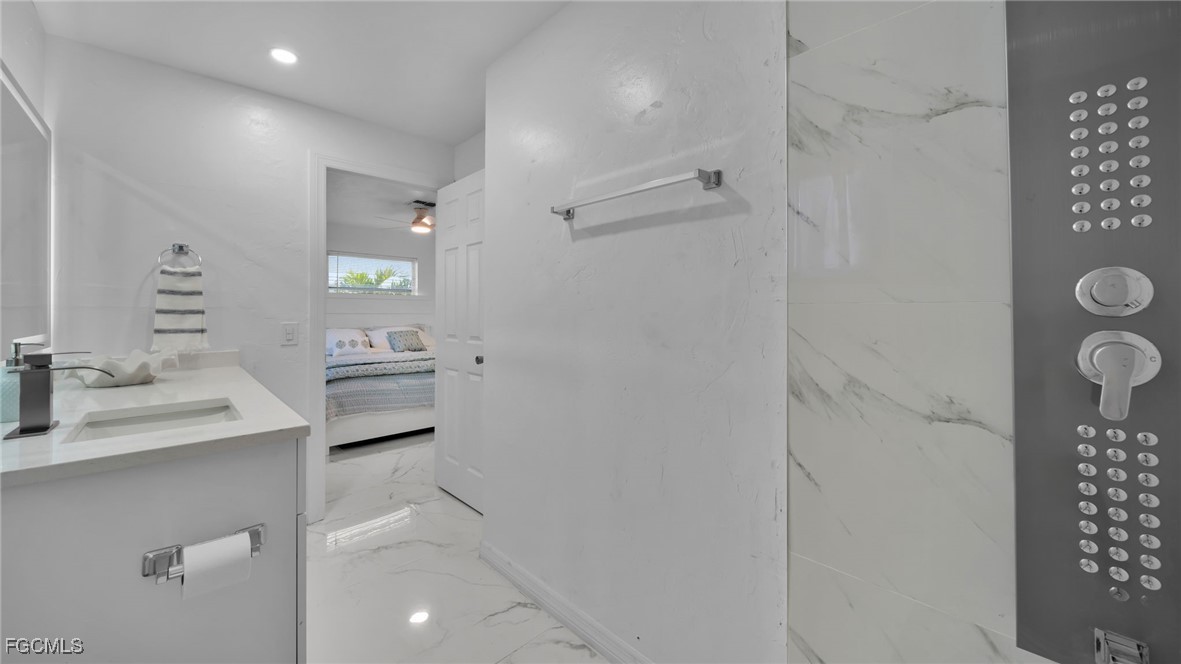 2758 Bruce Street Matlacha, FL 33993 - Photo 21 of 35 a bathroom with a sink toilet and shower