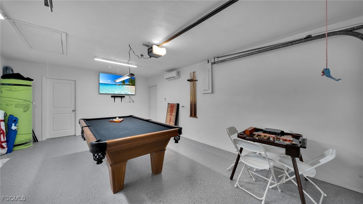 2758 Bruce Street Matlacha, FL 33993 - Photo 29 of 35 a room with furniture and a flat screen tv