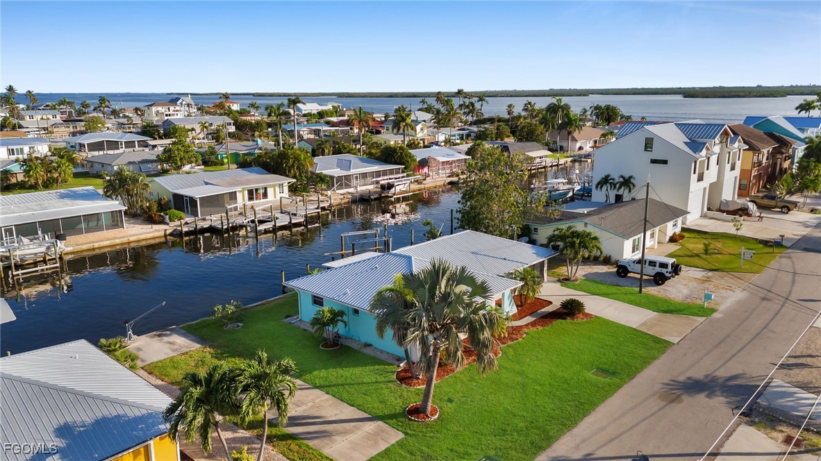 2758 Bruce Street Matlacha, FL 33993 - Photo 7 of 35 an aerial view of a house with a garden