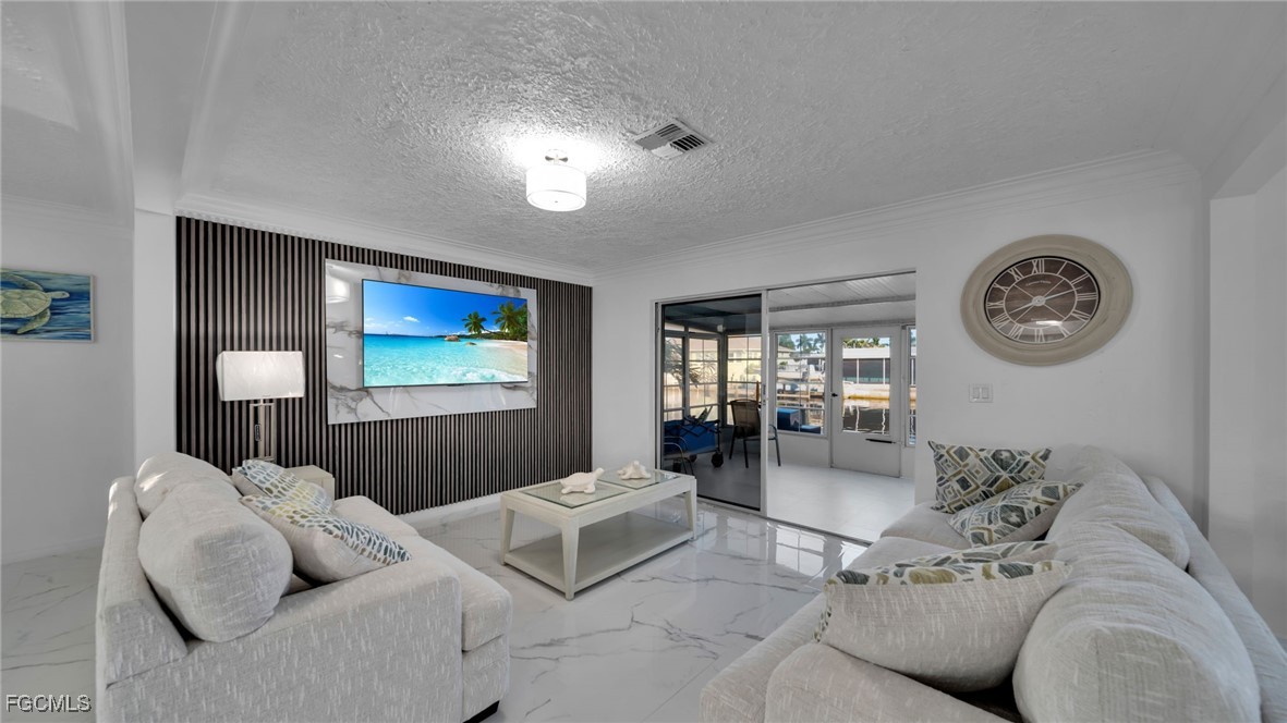 2758 Bruce Street Matlacha, FL 33993 - Photo 10 of 35 a living room with furniture and a large window