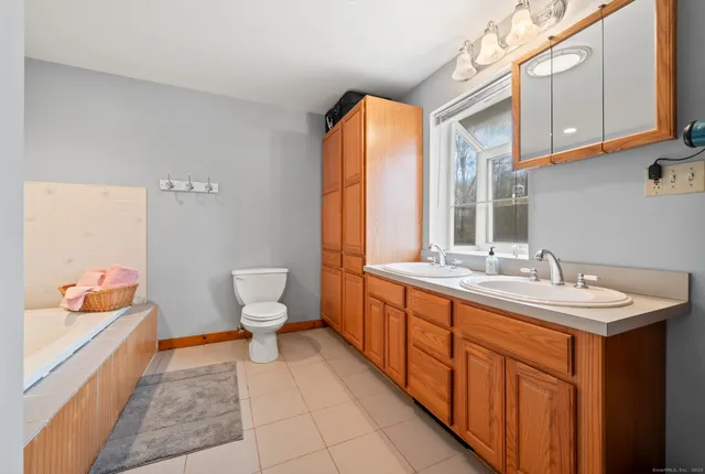 a bathroom with a bathtub and shower