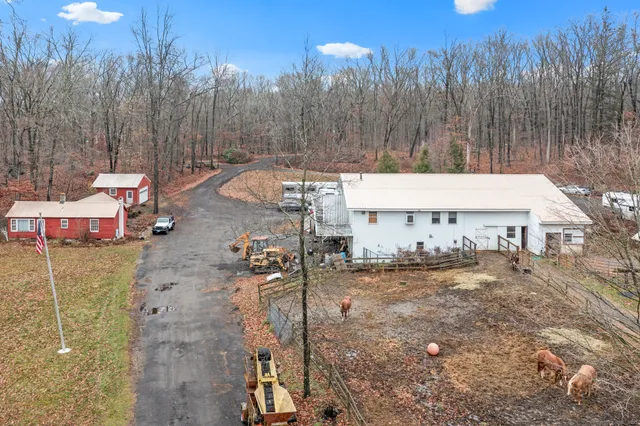 a view of a house with barbeque and wooden floor