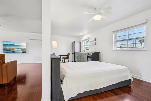 a bed room with a bed and a chandelier