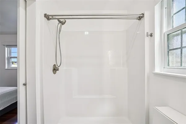 a large parking space with lots of cars parked in front of it