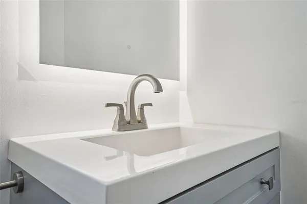 a view of a brick building next to a yard