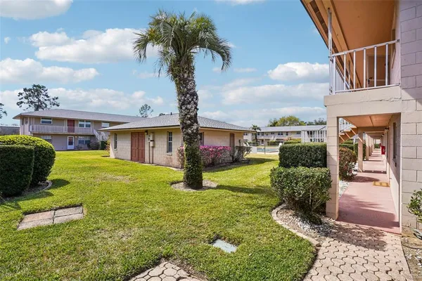 a view of a roof deck with sitting area