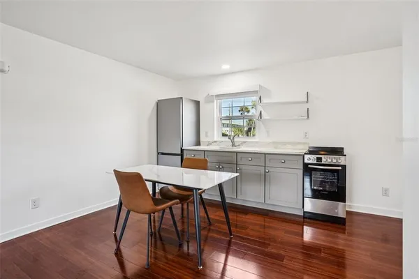 a kitchen with a table and chairs in it