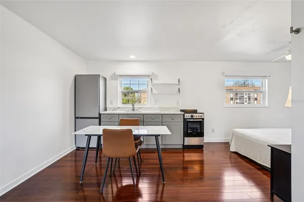 a view of a dining room with furniture and wooden floor
