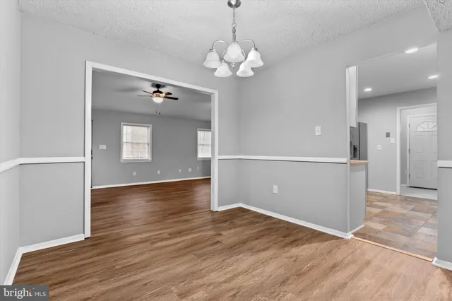 a view of a livingroom with wooden floor