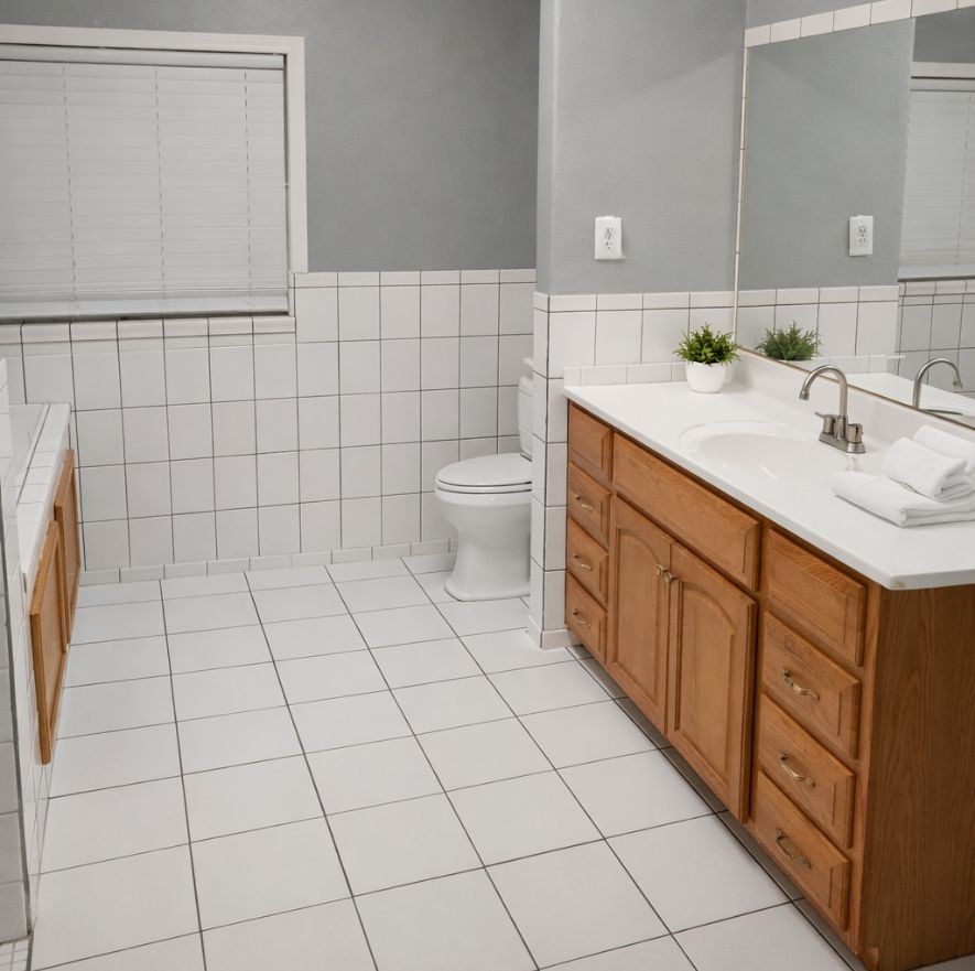 3314 Fern Street Pasadena, TX 77503 - Photo 11 of 14 a bathroom with a sink toilet and mirror